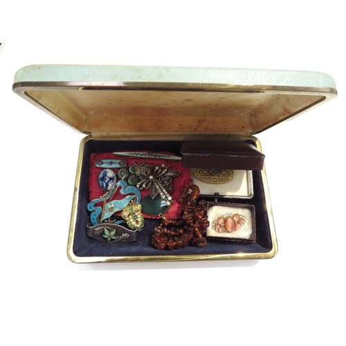 9427 - A jewellery box with contents including a Nelson, British Columbia silver enamelled brooch, amber ne... 