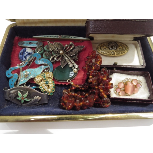 9427 - A jewellery box with contents including a Nelson, British Columbia silver enamelled brooch, amber ne... 