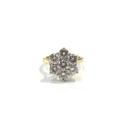 9003 - An 18ct gold diamond daisy ring, 1.50ct total approx. Size K, 4.6g