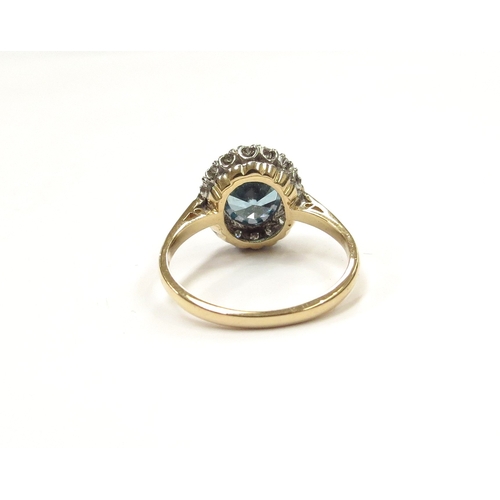 9016 - An 18ct gold platinum set zircon and diamond cluster ring. Size L, 3.7g