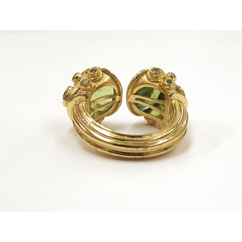 9067 - A silver gilt peridot Etruscan style ring. Size N, 13.5g