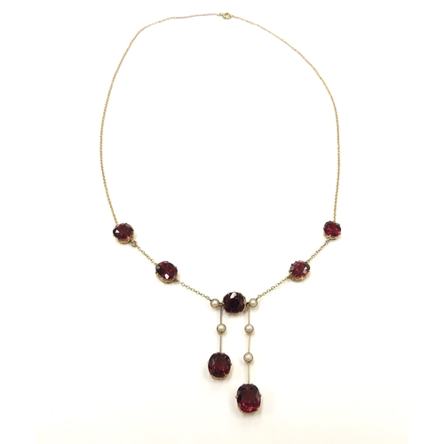 9070 - A gold garnet and pearl drop necklace, stamped 9k, 46cm long, 7.3g