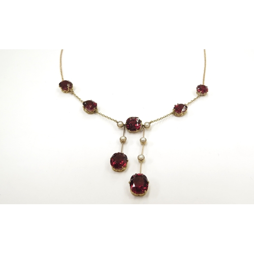 9070 - A gold garnet and pearl drop necklace, stamped 9k, 46cm long, 7.3g