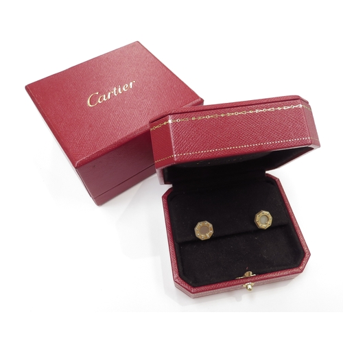 9064 - CARTIER; A pair of 18ct gold Santos Dumont stud earrings in original box and outer, 4.9g