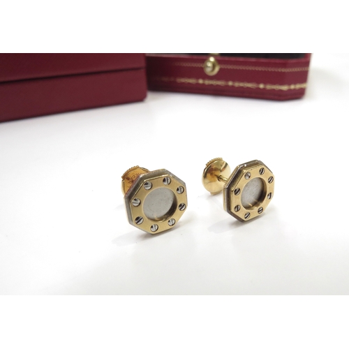 9064 - CARTIER; A pair of 18ct gold Santos Dumont stud earrings in original box and outer, 4.9g