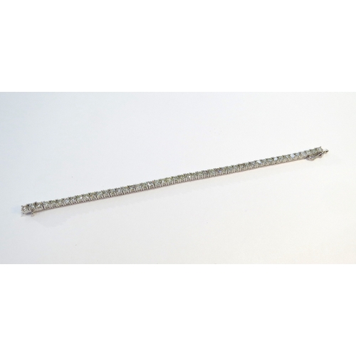 9114 - A diamond line bracelet with 49 round cut diamonds in four claw settings 7.35ct estimated total, sta... 