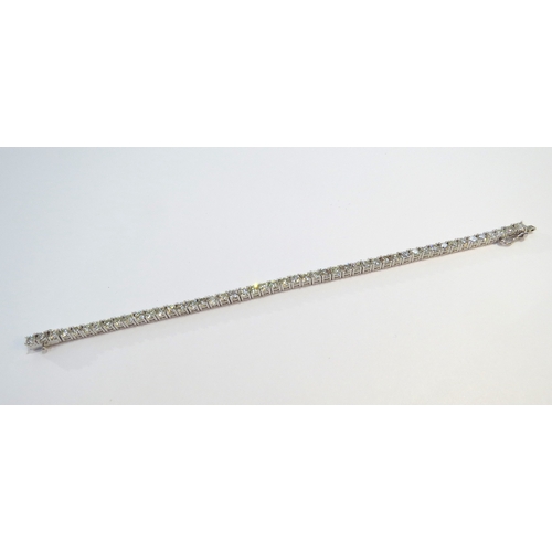 9114 - A diamond line bracelet with 49 round cut diamonds in four claw settings 7.35ct estimated total, sta... 