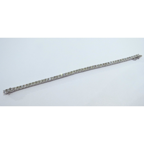 9114 - A diamond line bracelet with 49 round cut diamonds in four claw settings 7.35ct estimated total, sta... 