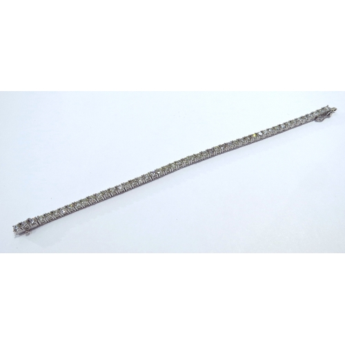 9114 - A diamond line bracelet with 49 round cut diamonds in four claw settings 7.35ct estimated total, sta... 