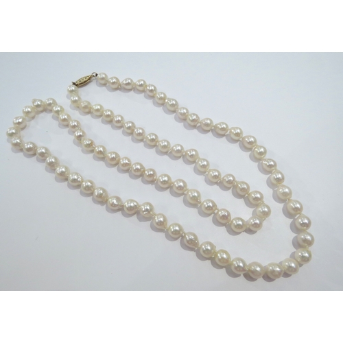 9147 - A cultured freshwater single row pearl necklace 81 Chinese pearls 6.5mm to 6.7mm, clasp stamped 14k,... 