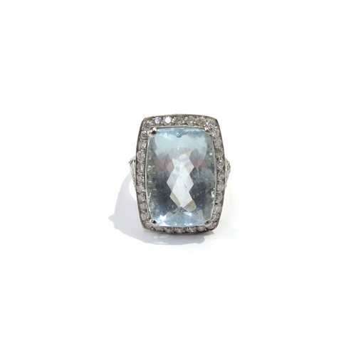 9158 - A cushion shaped aquamarine and diamond cluster ring the aquamarine 17mm x 112mm framed by 32 diamon... 