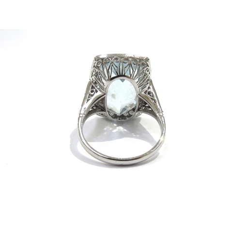 9158 - A cushion shaped aquamarine and diamond cluster ring the aquamarine 17mm x 112mm framed by 32 diamon... 