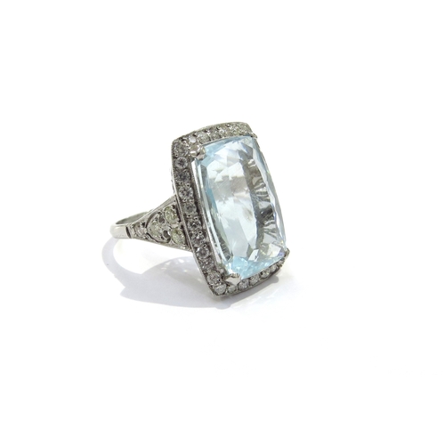 9158 - A cushion shaped aquamarine and diamond cluster ring the aquamarine 17mm x 112mm framed by 32 diamon... 