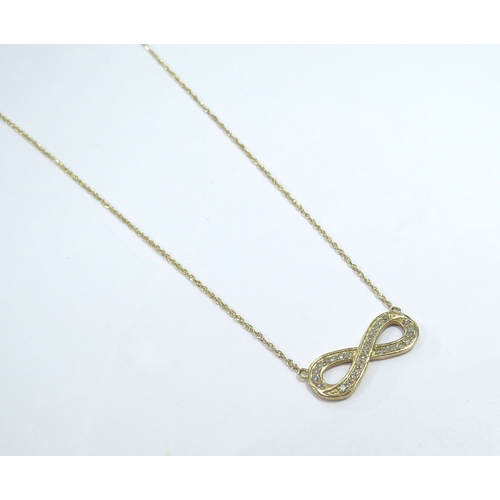 9072 - A 14ct gold diamond set eternity knot pendant on chain, 44cm long, 2g