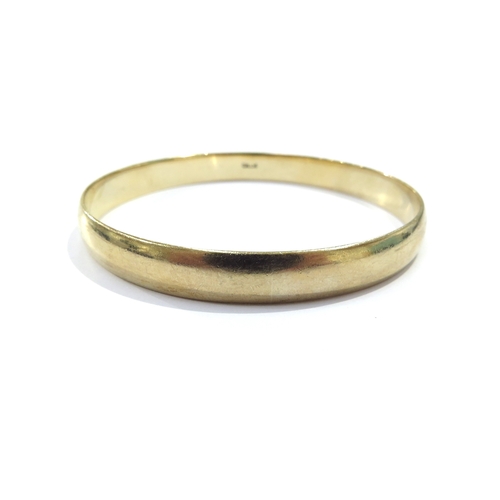 9091 - A 9ct gold bangle, 6.5cm diameter, 30g