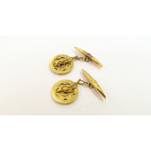 9357 - A pair of gold cufflinks of flower form with red stone to centre, 4.8g