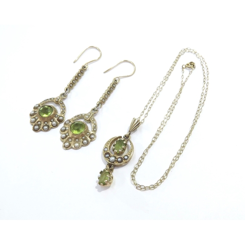 9146 - A pair of 9ct gold peridot and seed pearl drop earrings, 4cm drop and a similar pendant hung on a fi... 