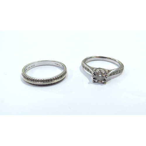 9132 - A 9ct white gold diamond solitaire with diamond set shoulders and a 9k white gold band with diamond ... 