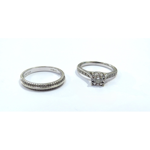 9132 - A 9ct white gold diamond solitaire with diamond set shoulders and a 9k white gold band with diamond ... 