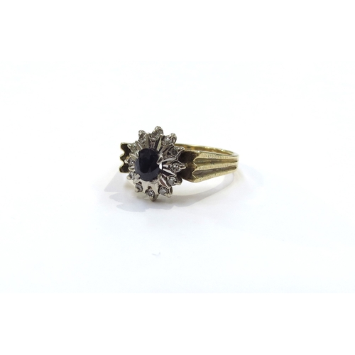 9204 - An 18ct gold sapphire and diamond cluster ring. Size M/N, 5g