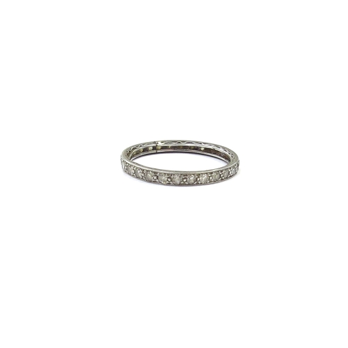 9134 - A white gold diamond eternity ring (altered), unmarked. Size  L, 1.3g