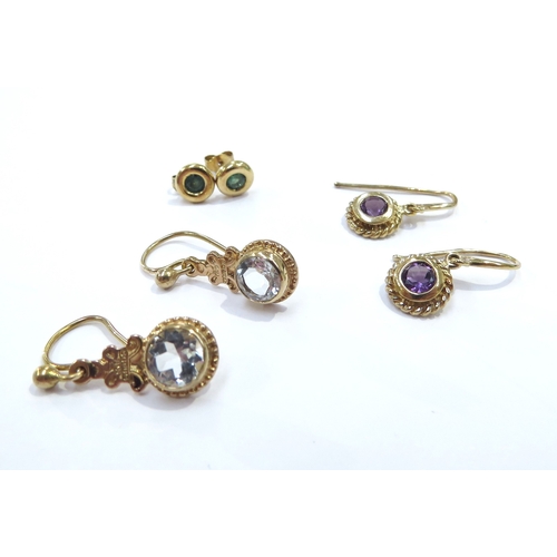 9122 - Three pairs of 9ct gold earrings including emerald studs, amethyst drops etc, 4.6g