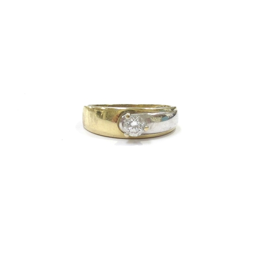 9089 - A two tone gold diamond solitaire ring, 0.33ct approx, unmarked. Size S, 4g