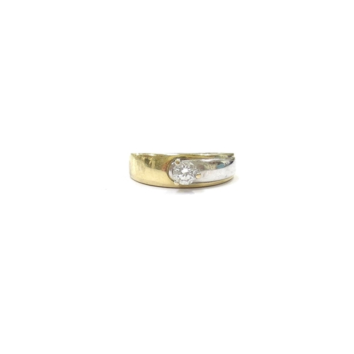 9089 - A two tone gold diamond solitaire ring, 0.33ct approx, unmarked. Size S, 4g