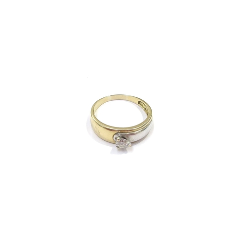 9089 - A two tone gold diamond solitaire ring, 0.33ct approx, unmarked. Size S, 4g