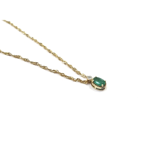 9090 - An emerald and diamond pendant hung on 9ct gold chain, 44cm long, 1.9g