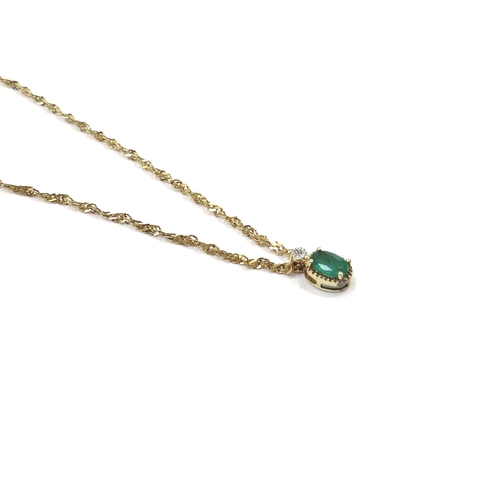 9090 - An emerald and diamond pendant hung on 9ct gold chain, 44cm long, 1.9g