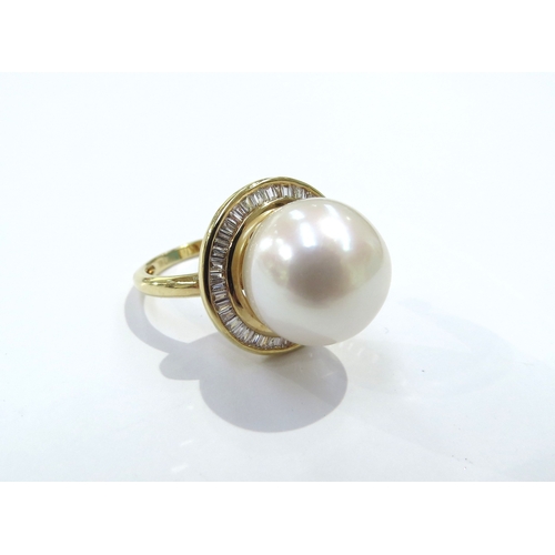 9079 - An 18ct gold Iliana pearl and diamond ring the centre pearl 12cm diameter framed by diamonds. Size M... 