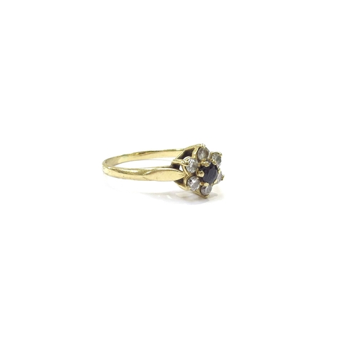 9203 - An 18ct gold sapphire and diamond daisy ring. Size L, 2.3g