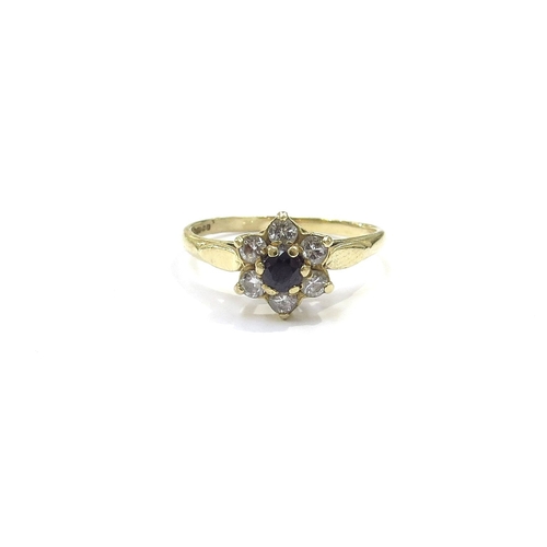 9203 - An 18ct gold sapphire and diamond daisy ring. Size L, 2.3g