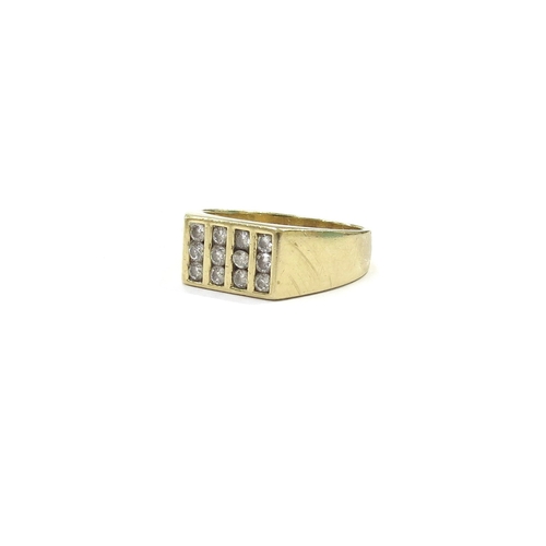 9108 - An 18ct gold ring set with 12 diamonds in rectangular setting. Size T, 8.5g