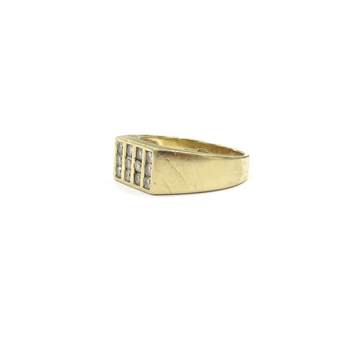 9108 - An 18ct gold ring set with 12 diamonds in rectangular setting. Size T, 8.5g