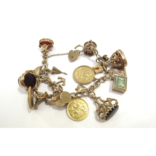 9069 - A 9ct gold charm bracelet hung with an 1892 gold sovereign, 1905 gold half sovereign, 9ct gold carou... 