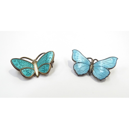 9399 - An Aksel Holmsen Norwegian silver enamelled butterfly brooch, 2.4cm wide and another (2)