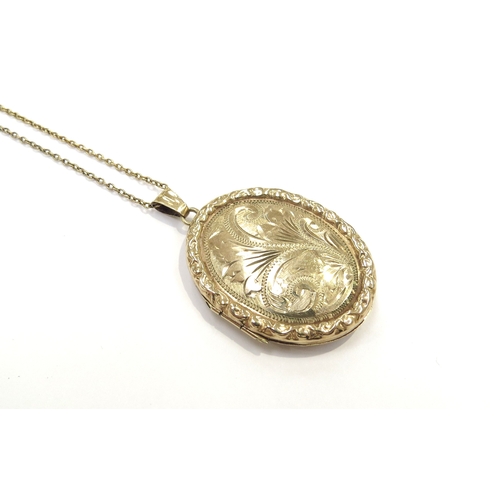 9381 - A 9ct gold locket hung on chain stamped 9ct, 46cm long, 9.5g