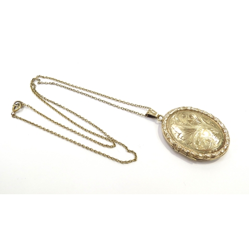 9381 - A 9ct gold locket hung on chain stamped 9ct, 46cm long, 9.5g