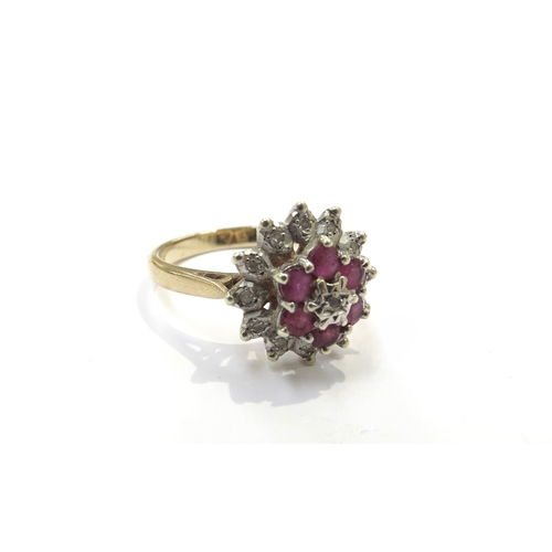 9385 - A 9ct gold diamond and ruby floral cluster ring. Size O, 3.3g