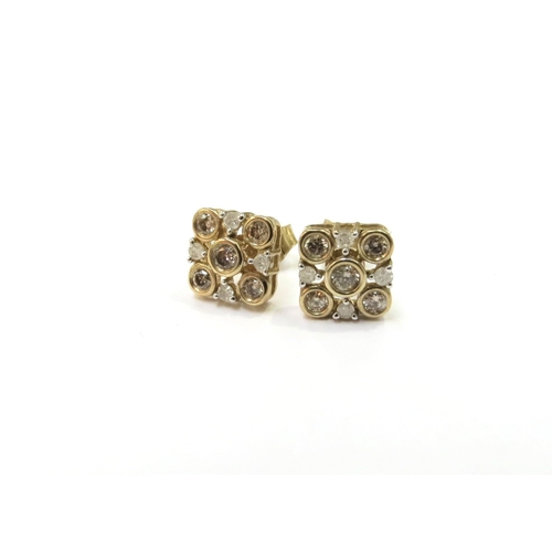 9244 - A pair of 9ct gold Champagne and white diamond cluster earrings, 1.9g