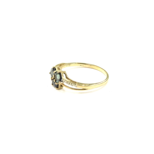 9249 - A 9ct gold Nigerian Blue sapphire and diamond ring. Size U, 2.2g