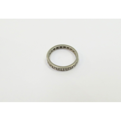 9047 - A half hoop diamond ring, unmarked platinum. Size Q, 4.3g