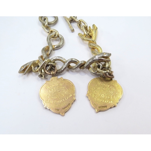 9268 - Two 9ct gold Football medals, 15.8g approx hung on a snake link metal bracelet