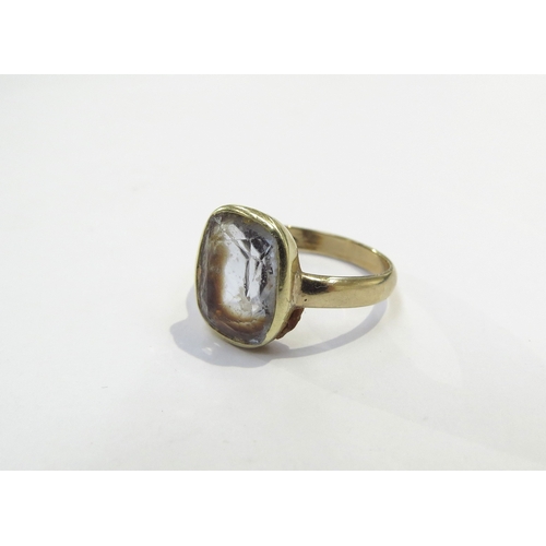 9187 - A gold ring set with a pale blue stone, marks rubbed. Size H, 3g