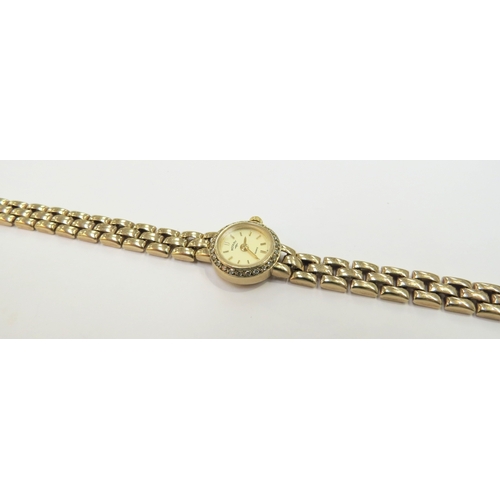 9045 - A Rotary 9ct gold lady's wristwatch with 9ct gold strap and diamond set bezel, 12mm diameter dial, 1... 