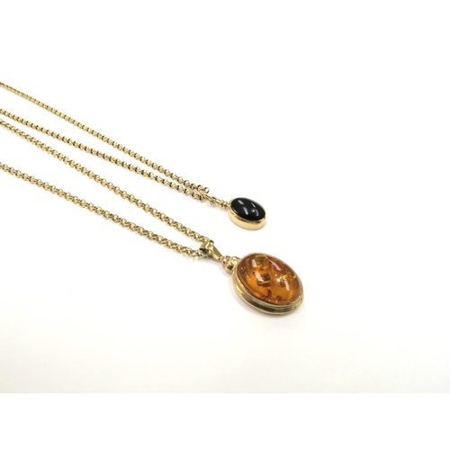 9103 - A 9ct gold belcher chain, 45cm long hung with an amber pendant and a gold belcher chain stamped 9c, ... 