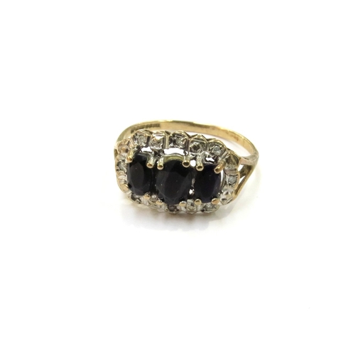 9120 - A 9ct gold sapphire and diamond chip cluster ring. Size N, 2.3g