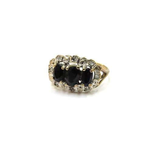 9120 - A 9ct gold sapphire and diamond chip cluster ring. Size N, 2.3g